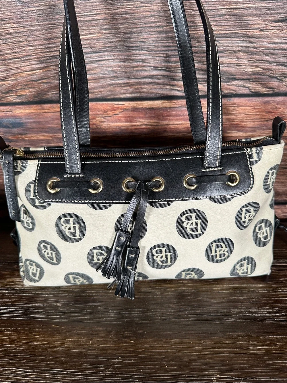 Dooney & Bourke Vintage logo jacquard handbag in cream and black.